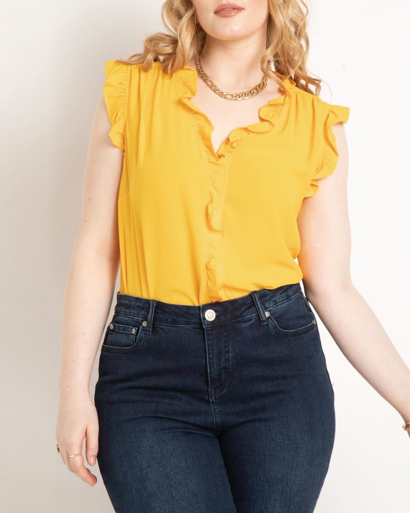Front of a model wearing a size 14 Claire Ruffle Blouse in Golden Yellow by ELOQUII. | dia_product_style_image_id:204085